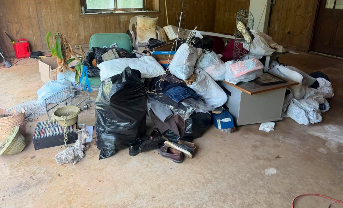 Garage in Bennington, NE packed with junk before removal