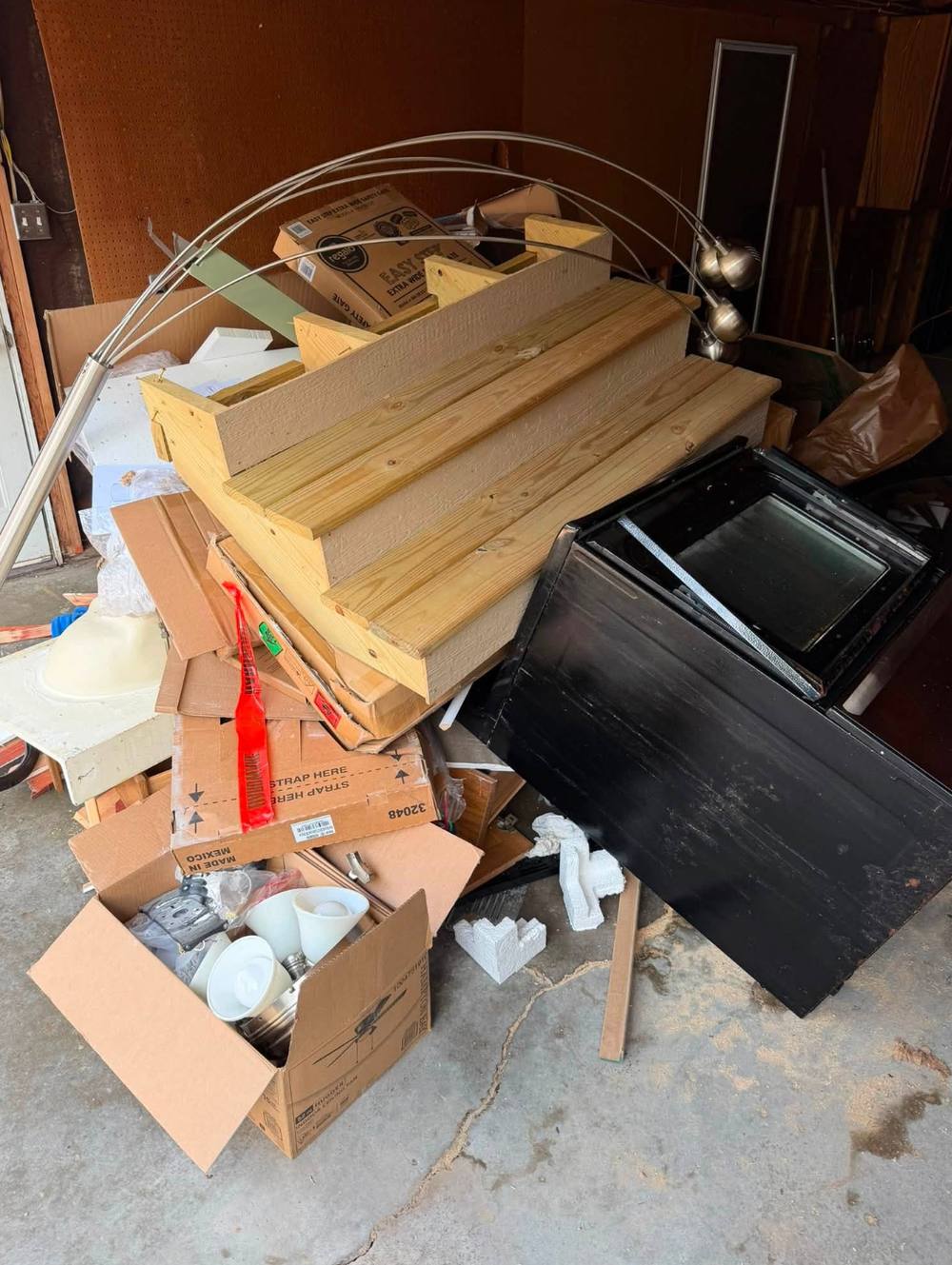 Furniture and appliances staged for junk removal pickup near Bennington NE
